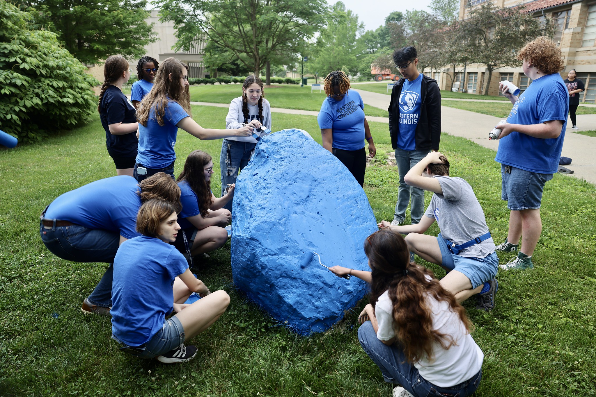 Orientation Student Ambassadors paint the EIU Spirit Rock for the first time