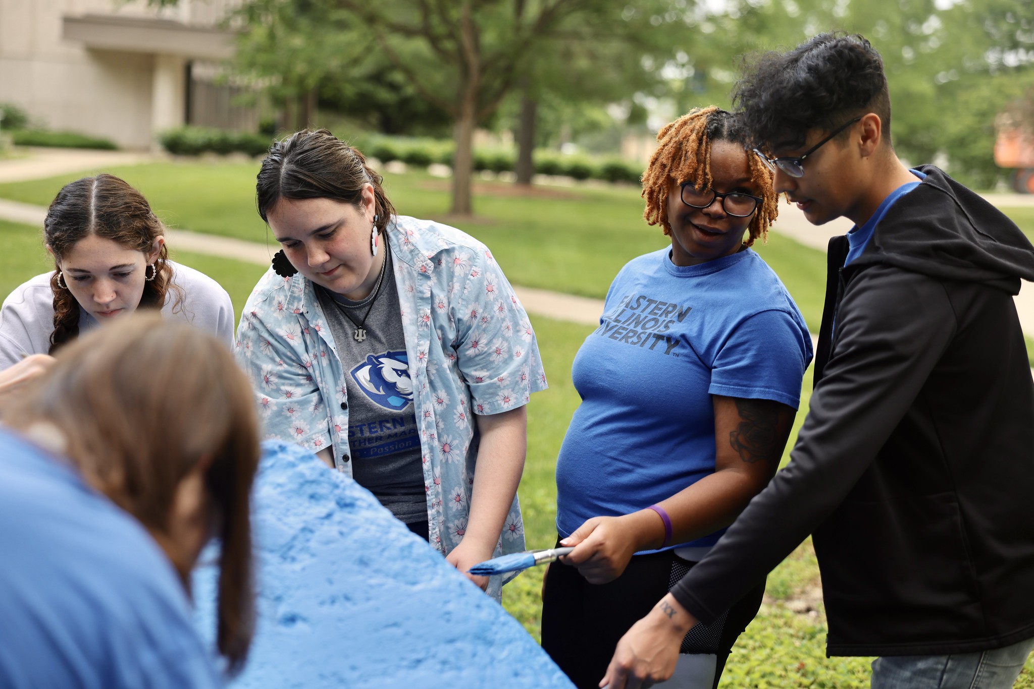 Orientation Student Ambassadors paint the EIU Spirit Rock for the first time