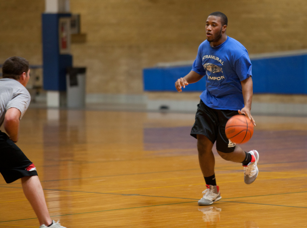 student playing basketball