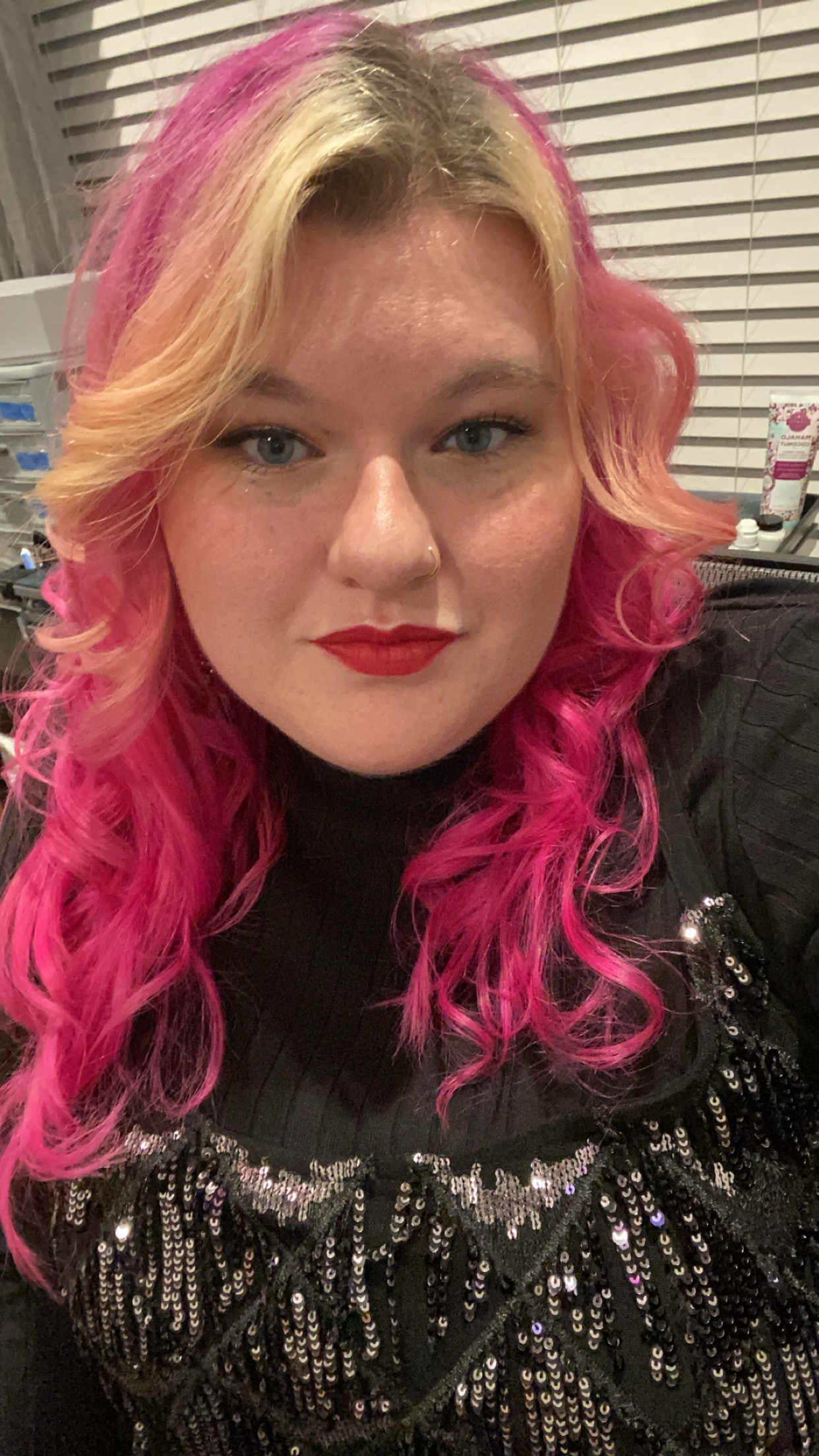 Blonde with pink accents in hair selfie woman